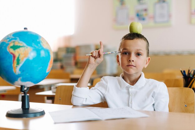 Boy posing and pointing up