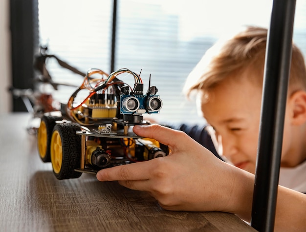 Boy putting on shelf robot