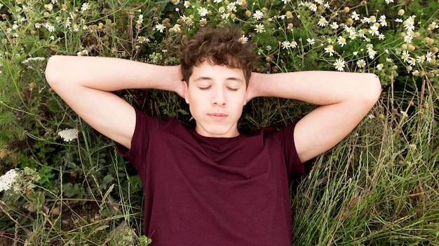 Boy relaxing and enjoying nature