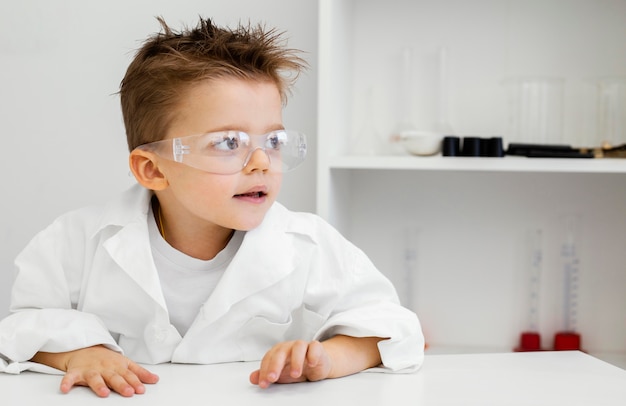 Boy scientist in the laboratory with safety glasses