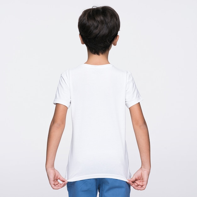 Free photo boy showing the back of shirt