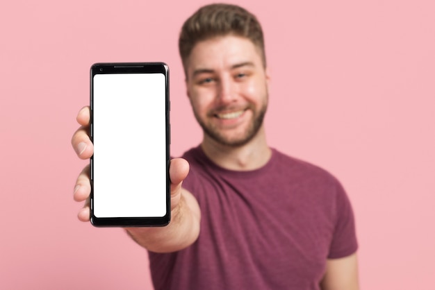 Boy showing mobile phone