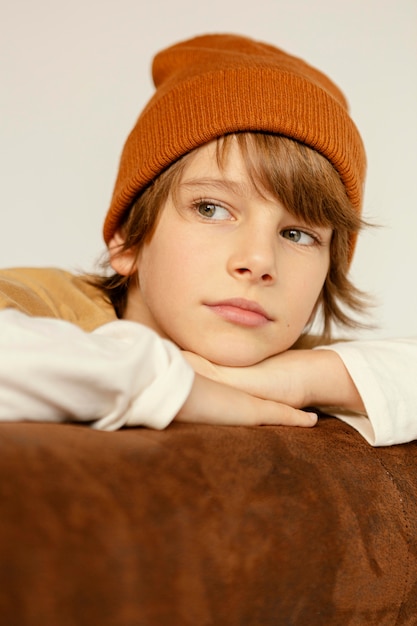 Free photo boy sitting on couch