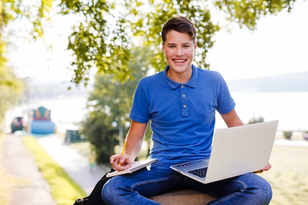 Boy studying in nature 