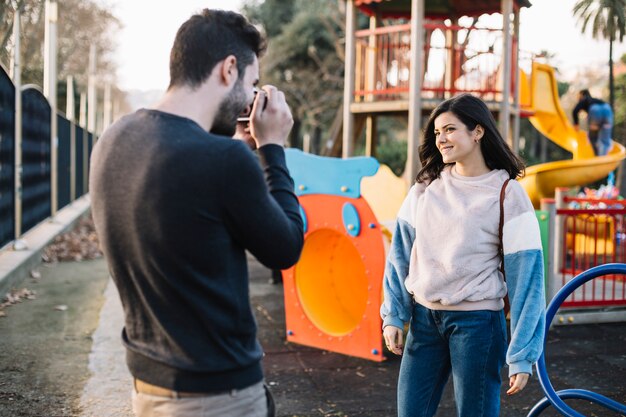 Boy taking picture to his girlfriend