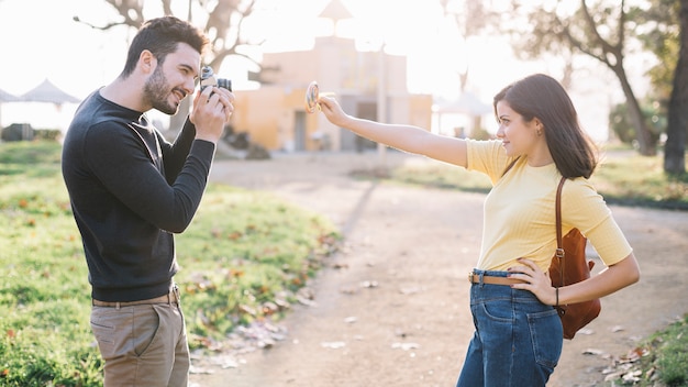 Boy taking a picture to his girlfriend