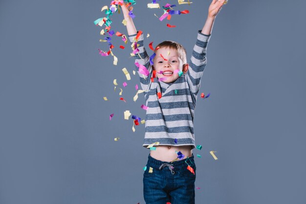 Boy throwing confetti