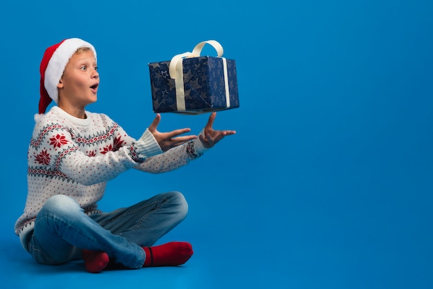 Boy throwing  gift copy space