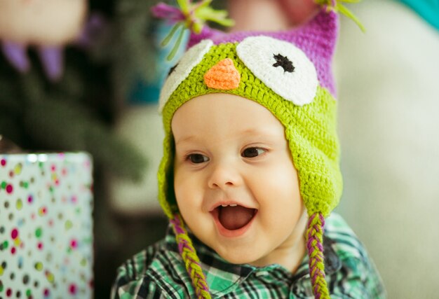 "Boy toddler wearing hat smiling"