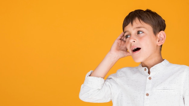 Boy trying to understand something with copy space