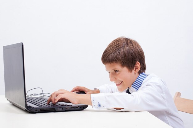 Boy using his laptop computer