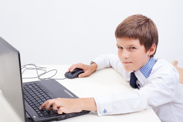 Boy using his laptop computer