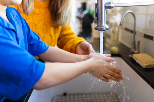 Free photo boy washing hands in the new normal