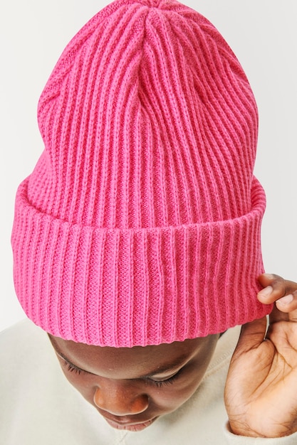 Boy wearing pink beanie 