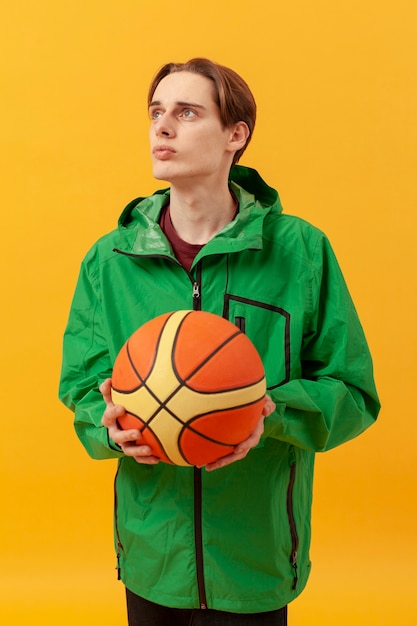 Free photo boy with basketball ball