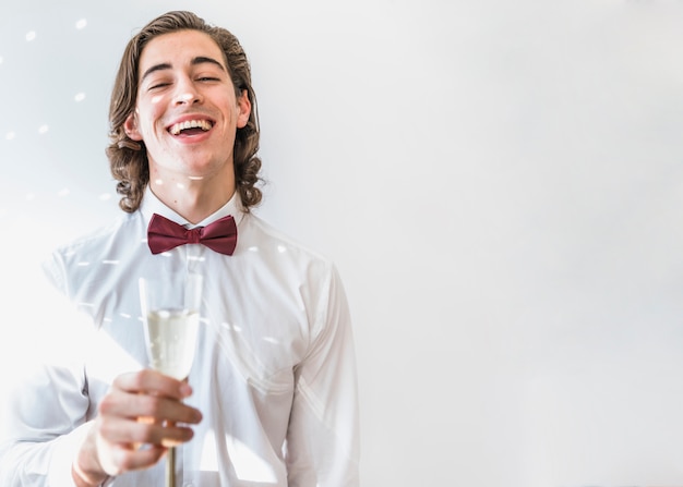 Boy with champagne at new year party