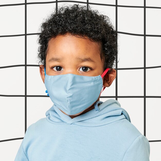 Boy with face mask in studio