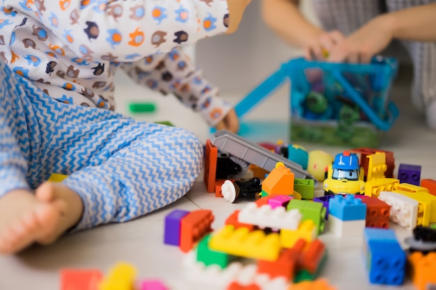 boy with mom playing in colorful building kit