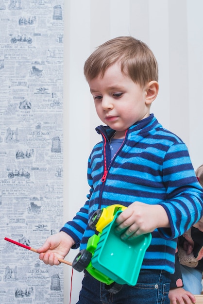 Boy with toy car