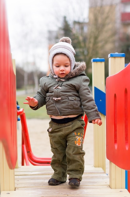 Free photo boy on wooden platform