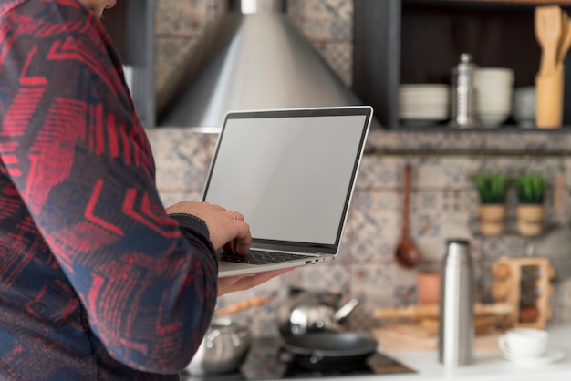 Boy working on grey laptop