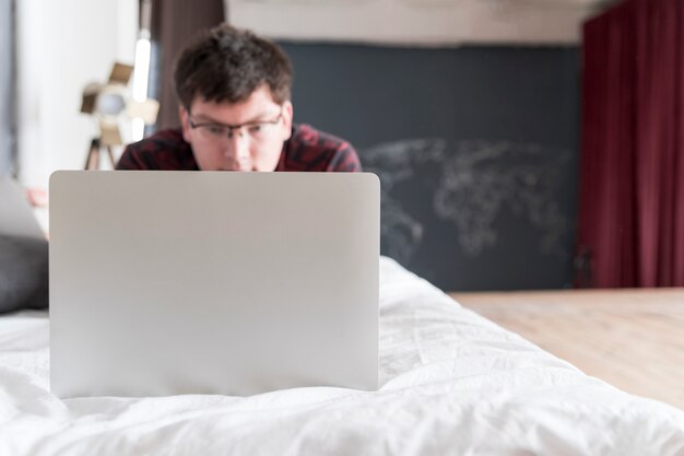 Boy working on grey laptop