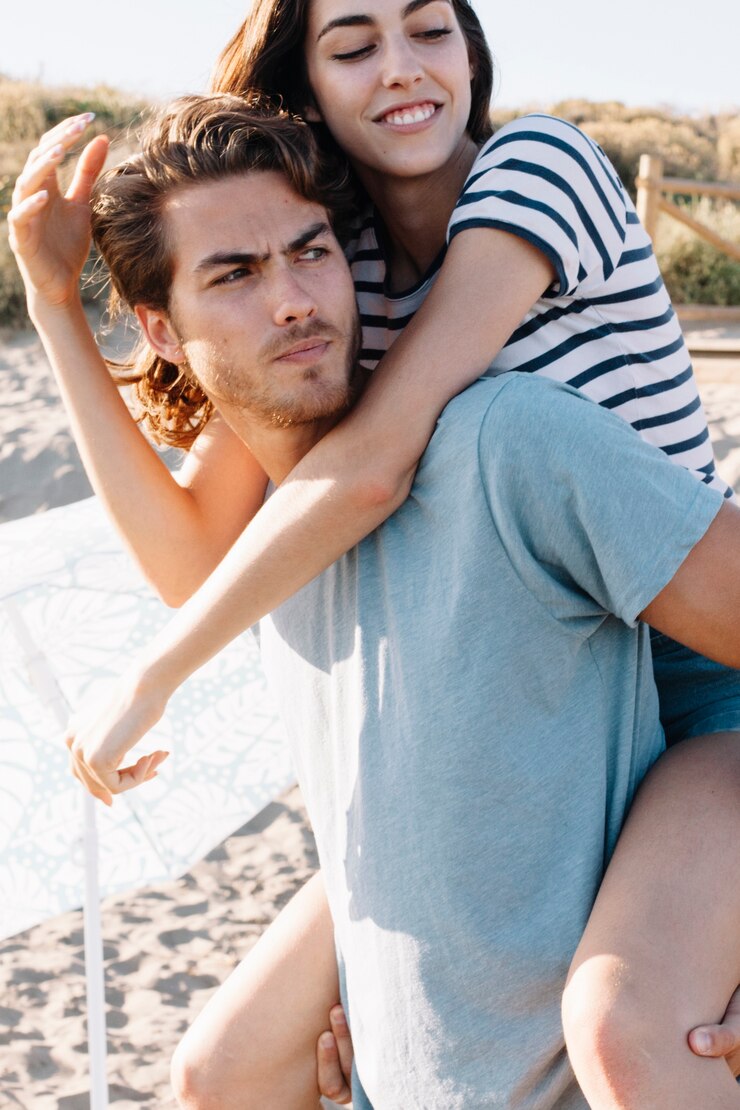 Free Photo boyfriend carrying girlfriend