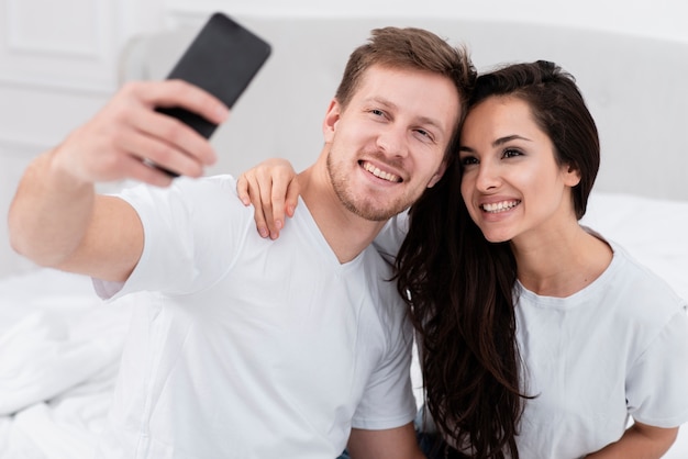 Boyfriend and girlfriend taking a selfie