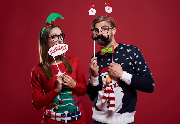 Boyfriend and girlfriend with Christmas masks