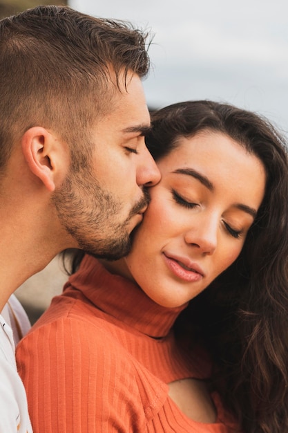 Boyfriend kissing woman