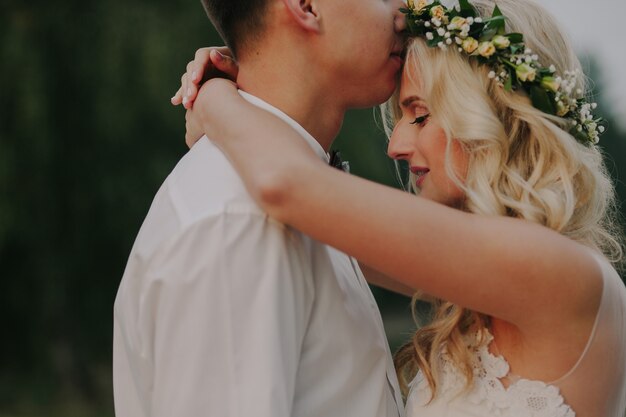 Boyfriends embracing with defocused background