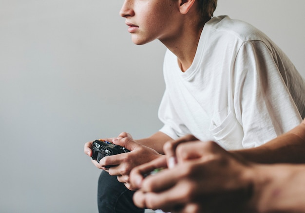 Boys playing video games together