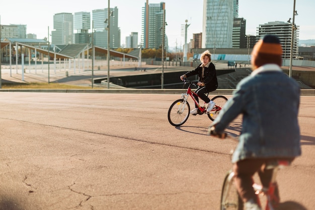 Boys riding their bikes outdoors in the city