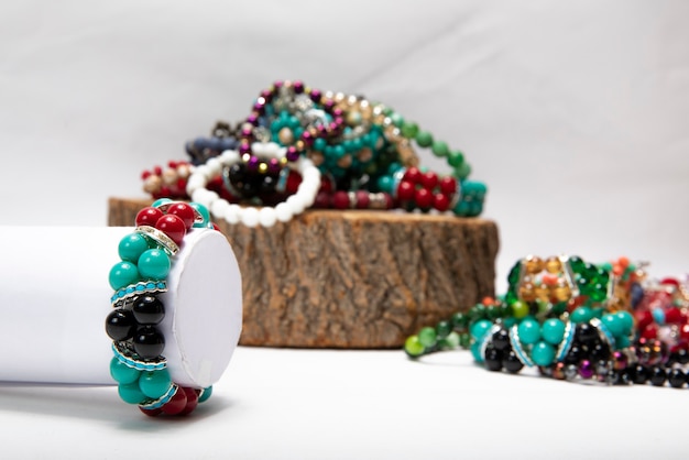 Free photo bracelets made by colorful pearls and stones.