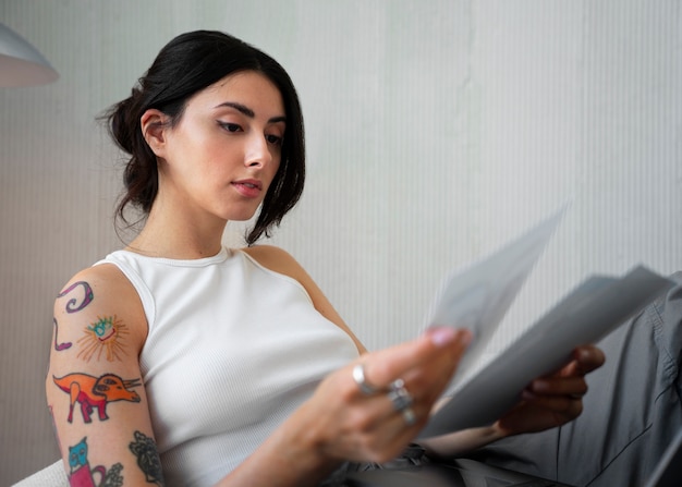 Free photo braless woman working indoor