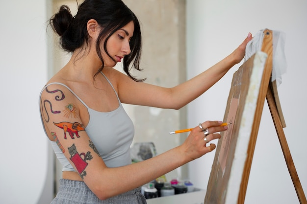 Free photo braless woman working indoor