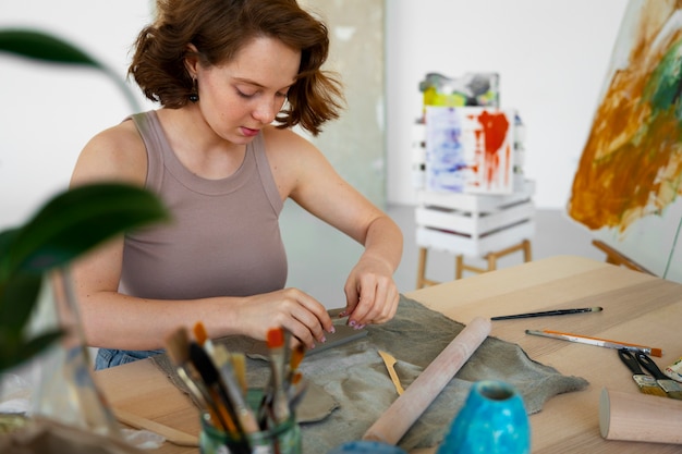 Free photo braless woman working indoor