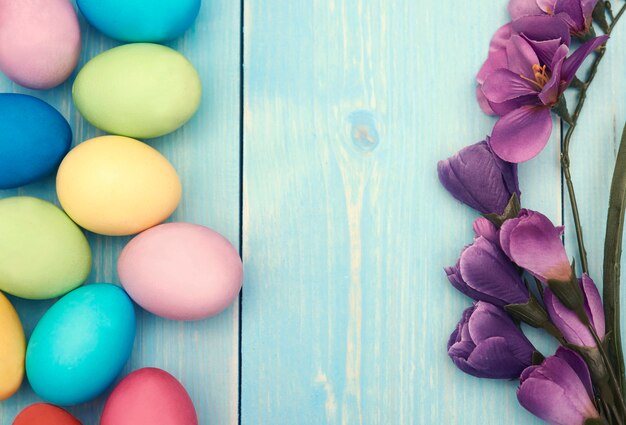 Branch of lilac flower and colorful easter eggs