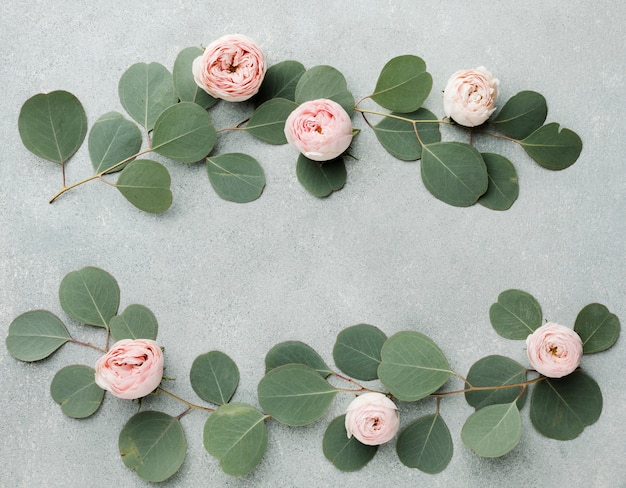 Branches and roses arrangement flat lay