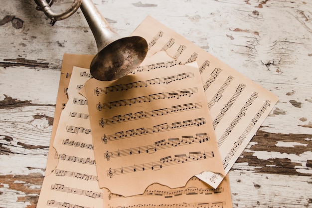 Brass trumpet on sheet music