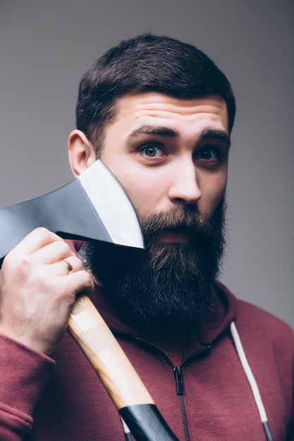 Free photo brave enough. brutal lumberjack. cutting wood. sharp blade. brutality and masculinity. bearded lumberjack. lumberjack style. man with axe. bearded man hold axe isolated on white. danger concept.