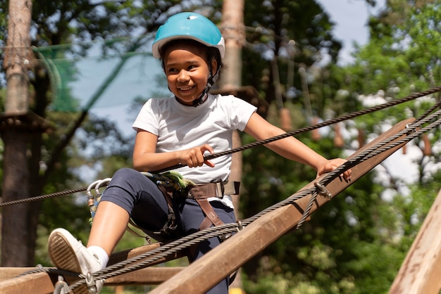 Free photo brave girl having fun at an adventure park