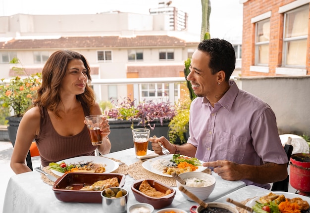 Free photo brazilian family enjoying meal together