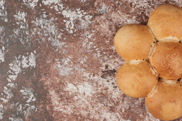 Free photo bread buns on marble.