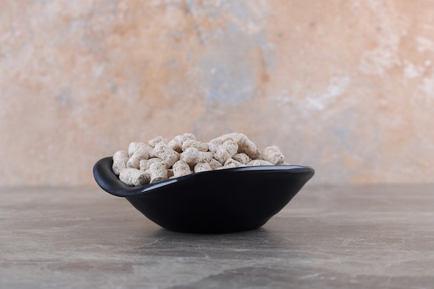 Bread crumbs in the bowl, on the marble surface