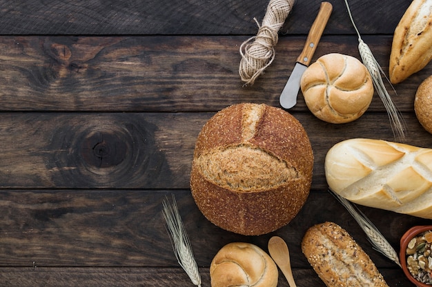 Bread and knives on wooden tabletop