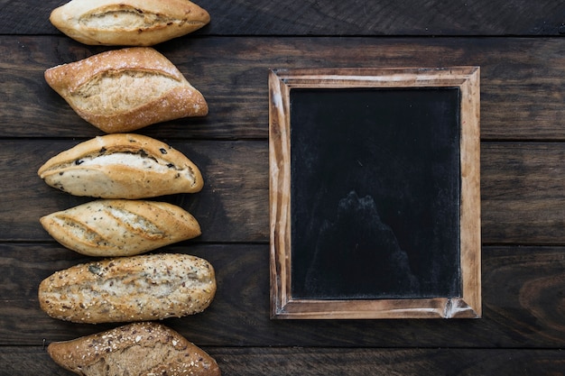 Bread lying near chalkboard