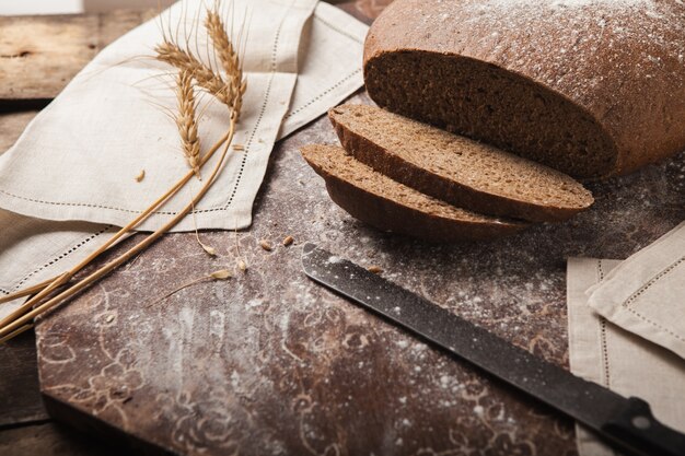 Bread rye spikelets on an wooden background