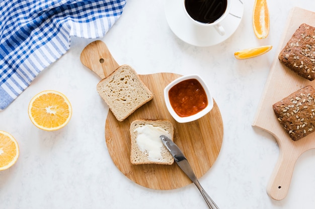 Bread slice with butter and jam