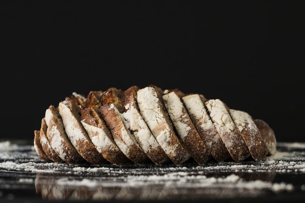 Bread slices against black background